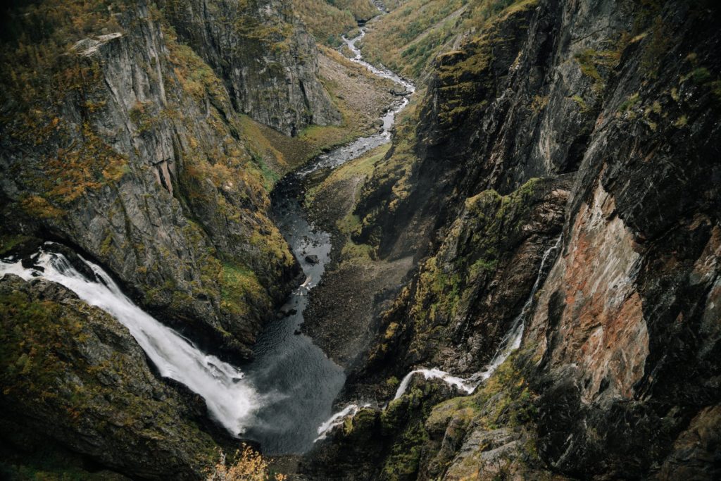 waterfall in mountainous terrain with steep slopes
